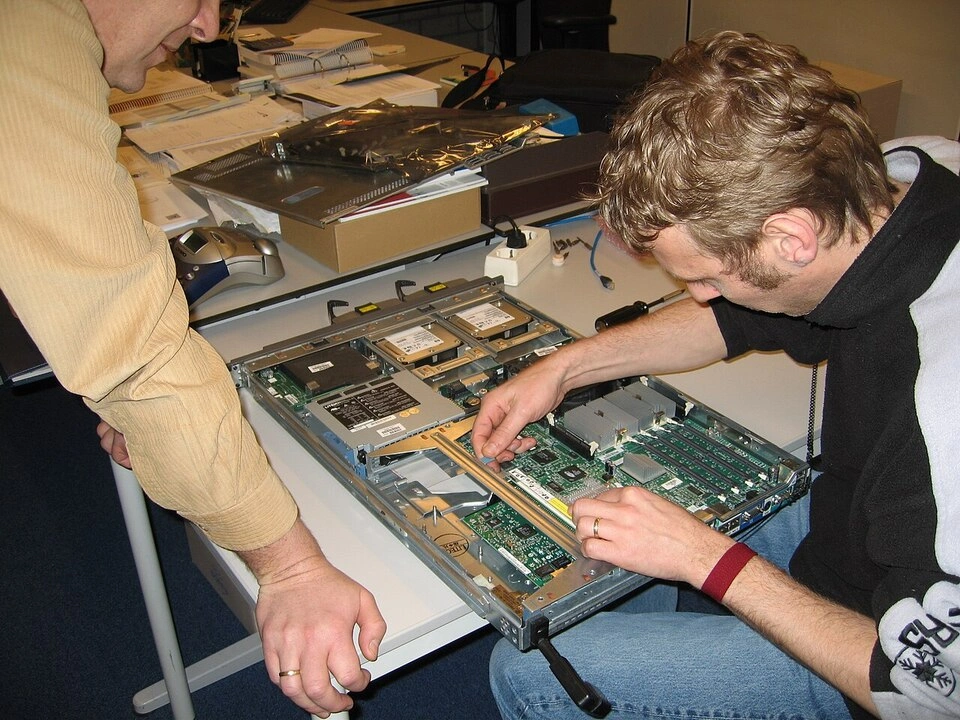 A man repairing a server